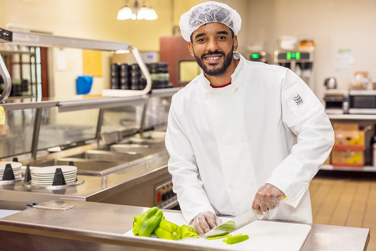 The chef cutting veggies at Villages of St Peters