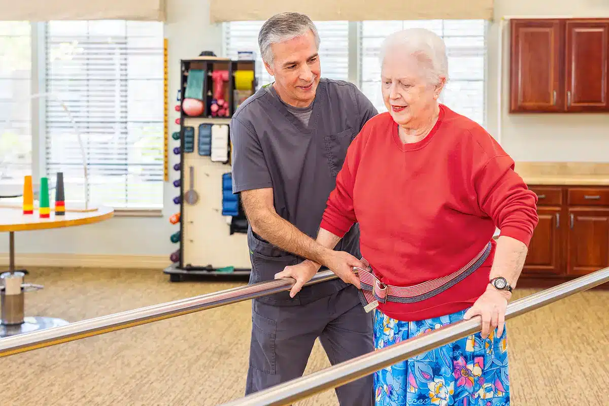 A woman doing physical therapy with a therapist at Villages of St Peters