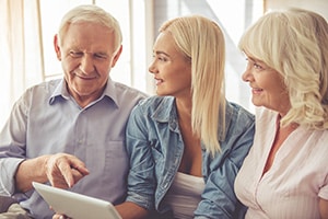 A family looking through picture albums together.